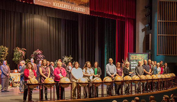To celebrate their 20-year anniversaries, 39 Melaleuca employees received checks for $20,000 ($33,000 net) and floor world globes during a Melaleuca employee meeting.