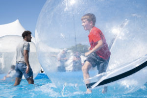 Boy in a big clear ball on walking on water
