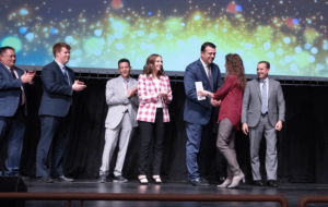 Melaleuca President Cole, CEO Jerry Felton and others Clinger congratulating longevity recipient