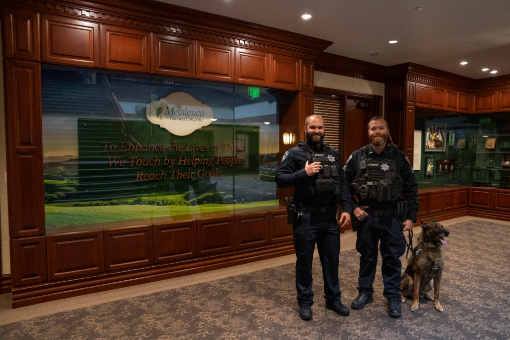 Two IFPD officers and a K-9 at Melaleuca